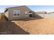 A new home backyard space awaiting landscaping and personalization, fenced for privacy and ready for your dream design at 37028 W Prado St, Maricopa, AZ 85138