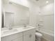 Bathroom featuring dual sinks, a large mirror, and a shower-tub combination at 37028 W Prado St, Maricopa, AZ 85138