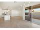 Living room with an open floor plan and sliding glass doors at 37028 W Prado St, Maricopa, AZ 85138