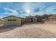 Modern home exterior with three-car garage and mountain views at 40564 N 50Th St, Cave Creek, AZ 85331