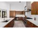 Modern kitchen with stainless steel appliances and wood cabinets at 40564 N 50Th St, Cave Creek, AZ 85331