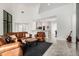 Modern living room with leather furniture and a view into the kitchen at 40564 N 50Th St, Cave Creek, AZ 85331