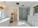 Spa-like bathroom with soaking tub, walk-in shower, and marble vanity at 6030 E Calle Del Sud St, Scottsdale, AZ 85251