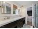 Sleek bathroom with double vanity, marble countertops, and glass shower at 6030 E Calle Del Sud St, Scottsdale, AZ 85251