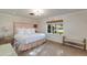 Spacious bedroom with plush bed, window seat, and neutral color palette at 6030 E Calle Del Sud St, Scottsdale, AZ 85251