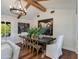 Bright dining area with a rustic table and modern chandelier at 6030 E Calle Del Sud St, Scottsdale, AZ 85251