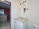 Clean bathroom with vanity and large mirror at 10350 W Alvarado Rd, Avondale, AZ 85392