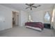 Spacious bedroom with a ceiling fan and large windows at 10350 W Alvarado Rd, Avondale, AZ 85392