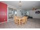 Bright dining area with a table and access to a patio at 10350 W Alvarado Rd, Avondale, AZ 85392