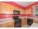 Kitchen with wood cabinets and built-in microwave at 10350 W Alvarado Rd, Avondale, AZ 85392