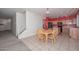 Kitchen and dining area with wood cabinets and a table for four at 10350 W Alvarado Rd, Avondale, AZ 85392