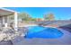 Refreshing blue pool with surrounding patio and fenced backyard at 10350 W Alvarado Rd, Avondale, AZ 85392