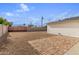 Backyard with gravel, patio, and a block wall at 1829 E Amelia Ave, Phoenix, AZ 85016