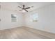 Spacious bedroom featuring light wood floors and two windows at 1829 E Amelia Ave, Phoenix, AZ 85016