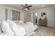 Serene bedroom featuring a large bed, neutral tones, and ensuite bathroom at 1829 E Amelia Ave, Phoenix, AZ 85016