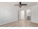 Bright bedroom with ensuite bathroom and light wood floors at 1829 E Amelia Ave, Phoenix, AZ 85016