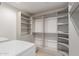 Large walk-in closet with ample shelving and hanging space at 1829 E Amelia Ave, Phoenix, AZ 85016