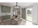 Bright dining area with a marble table and grey velvet chairs at 1829 E Amelia Ave, Phoenix, AZ 85016