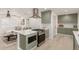 Eat-in kitchen with stainless steel appliances and an island at 1829 E Amelia Ave, Phoenix, AZ 85016