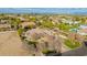 Aerial view of a house with a pool and landscaped yard at 2090 E Coconino Ct, Gilbert, AZ 85298