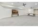 Spacious basement with a ping pong table and large TV at 2090 E Coconino Ct, Gilbert, AZ 85298