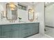 Spa-like bathroom with dual vanities, marble countertops, and a walk-in shower at 2090 E Coconino Ct, Gilbert, AZ 85298