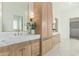 Elegant bathroom with double vanity, marble countertops, and large walk-in shower at 2090 E Coconino Ct, Gilbert, AZ 85298