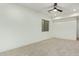 Simple bedroom with ceiling fan and carpeted floor at 2090 E Coconino Ct, Gilbert, AZ 85298