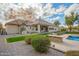 Back of house with pool and outdoor kitchen at 2090 E Coconino Ct, Gilbert, AZ 85298