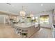 Open kitchen with island and Gathering room view, features a farmhouse sink at 2090 E Coconino Ct, Gilbert, AZ 85298