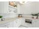 Bright white pantry with ample shelving and countertop space at 2090 E Coconino Ct, Gilbert, AZ 85298