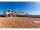 Spacious backyard with two-story home and block wall at 31730 N Waddle Ln, San Tan Valley, AZ 85143