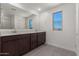 Modern bathroom with double vanity and large mirror at 31730 N Waddle Ln, San Tan Valley, AZ 85143