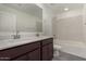 Bathroom boasts double sinks and a bathtub at 31730 N Waddle Ln, San Tan Valley, AZ 85143