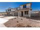 Two story house with gray garage doors and desert landscaping at 31730 N Waddle Ln, San Tan Valley, AZ 85143