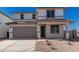 Two-story house with gray garage door and landscaping at 31730 N Waddle Ln, San Tan Valley, AZ 85143