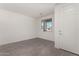 Bright foyer with gray tile floor and white door at 31730 N Waddle Ln, San Tan Valley, AZ 85143