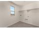 Laundry room with overhead shelving and window at 31730 N Waddle Ln, San Tan Valley, AZ 85143