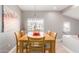 Light-filled dining room with wood table and chairs at 3236 E Chandler Blvd # 2033, Phoenix, AZ 85048