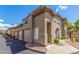 Tan stucco building with garage and landscaping at 3236 E Chandler Blvd # 2033, Phoenix, AZ 85048