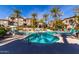 Community pool with lounge chairs and a spa at 3236 E Chandler Blvd # 2033, Phoenix, AZ 85048