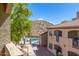 Community pool and surrounding complex view at 3236 E Chandler Blvd # 2033, Phoenix, AZ 85048