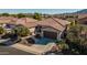 Single-story home with a two-car garage and desert landscaping at 3415 E Sports Dr, Gilbert, AZ 85298