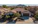 Single-story home with a two-car garage and desert landscaping at 3415 E Sports Dr, Gilbert, AZ 85298