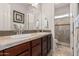 Double vanity bathroom with a large shower and tile flooring at 3415 E Sports Dr, Gilbert, AZ 85298