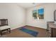 Versatile bedroom with yoga mat and window with shutters at 3415 E Sports Dr, Gilbert, AZ 85298