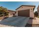 Two-car garage with paver driveway and landscaping at 3415 E Sports Dr, Gilbert, AZ 85298