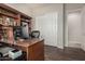 Bright home office features built-in shelving and wood desk at 3415 E Sports Dr, Gilbert, AZ 85298