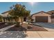 One-story home with desert landscaping and two-car garage at 3415 E Sports Dr, Gilbert, AZ 85298