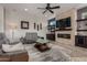 Bright and airy living room with fireplace and built-in shelving at 3415 E Sports Dr, Gilbert, AZ 85298